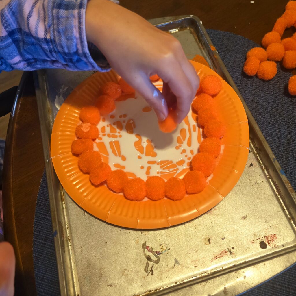 Gluing pom poms